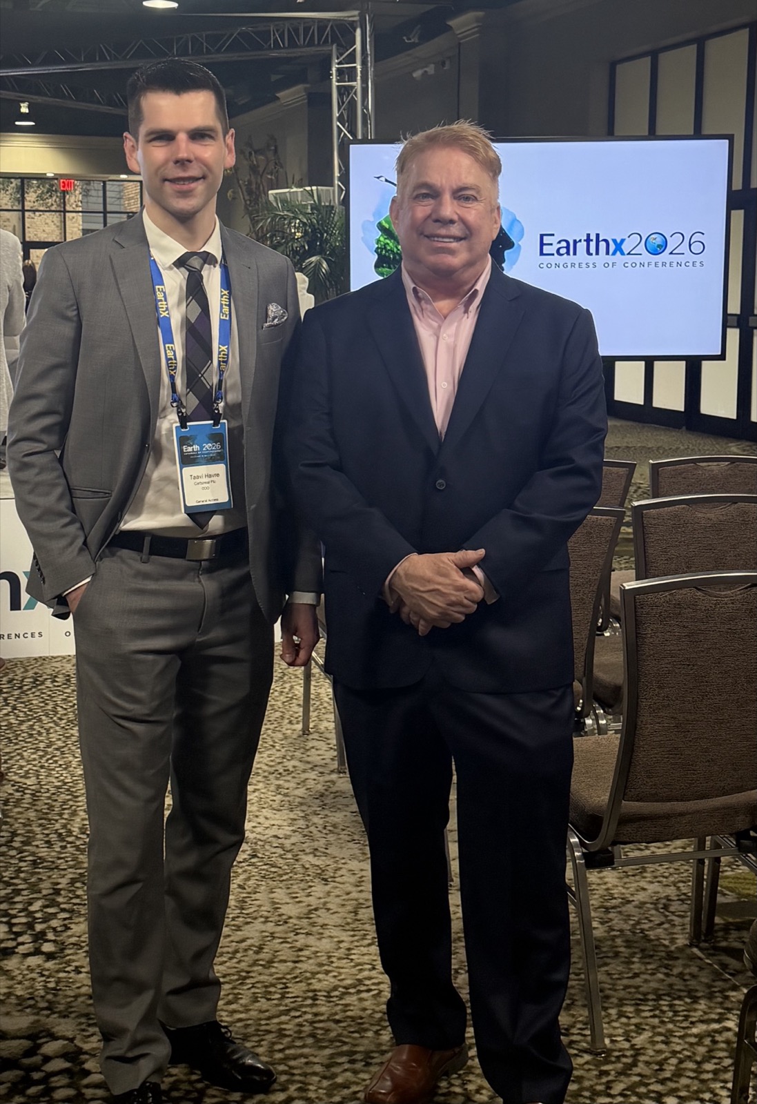 Taavi Havre of Carboreal and Steve Bender standing in front of an EarthX 2026 Congress of Conferences screen